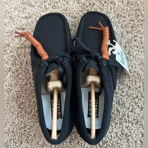 Clark’s black suede wallabees